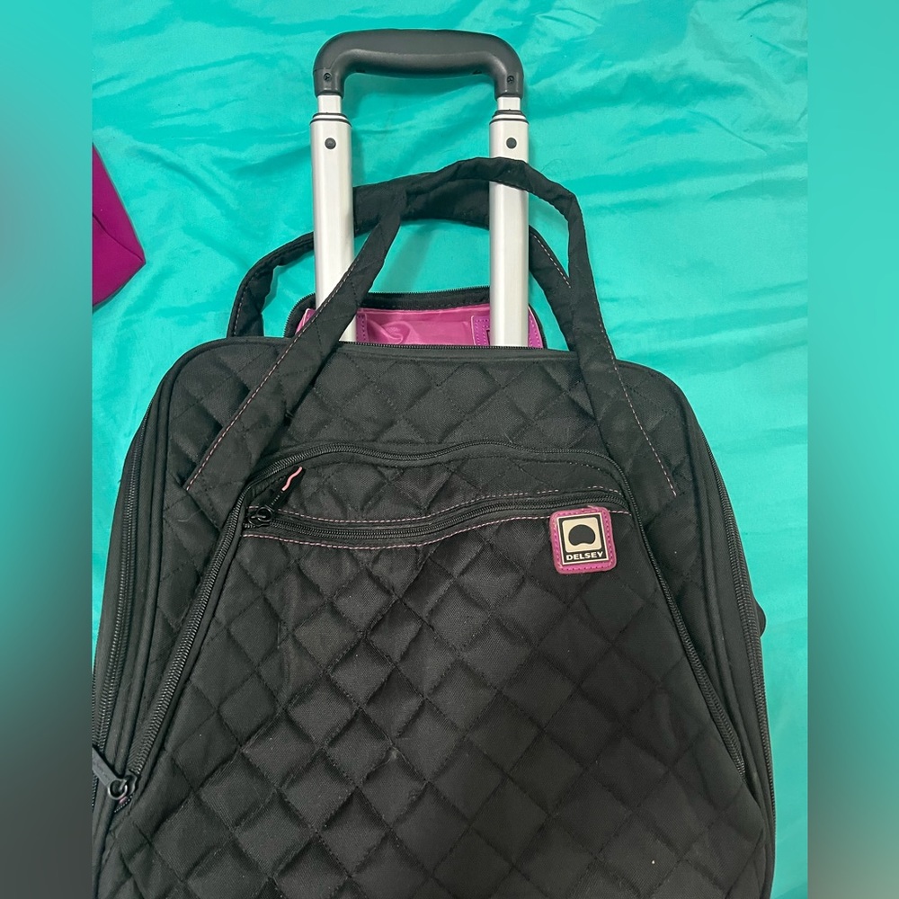Delsey pink and black rolling laptop bag